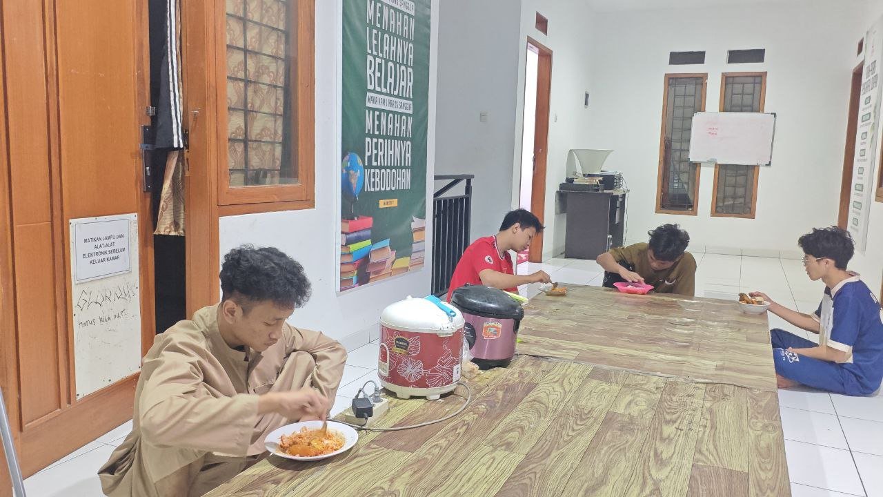 A group of people eating at a table AI-generated content may be incorrect.