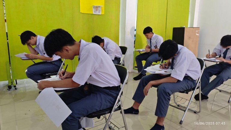 A group of students sitting at desks

AI-generated content may be incorrect.