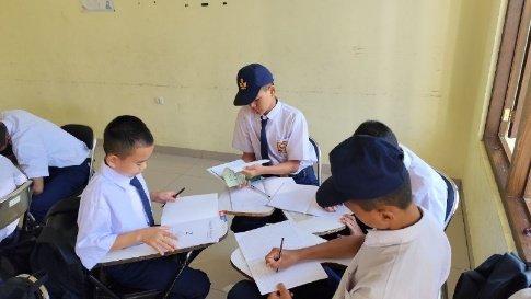 A group of young boys sitting at desks

AI-generated content may be incorrect.