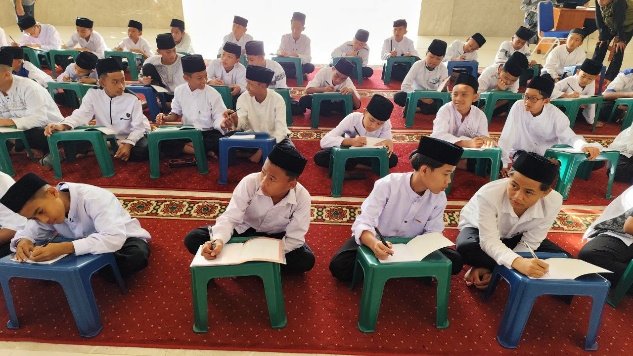 A group of young boys sitting in a classroom AI-generated content may be incorrect.