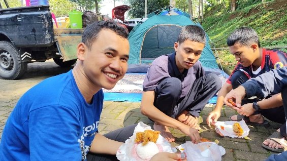 A group of men sitting outside by a tent

AI-generated content may be incorrect.