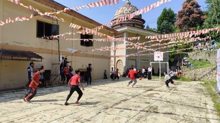 A group of people playing football AI-generated content may be incorrect.
