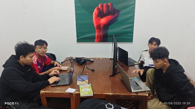 A group of people sitting at a table with laptops AI-generated content may be incorrect.