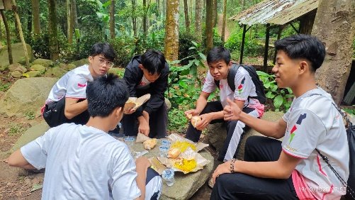 A group of people sitting around a table AI-generated content may be incorrect.