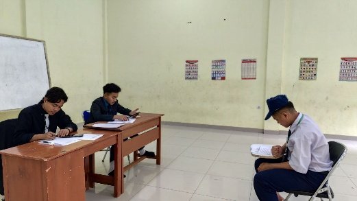 A group of people sitting at a desk

AI-generated content may be incorrect.