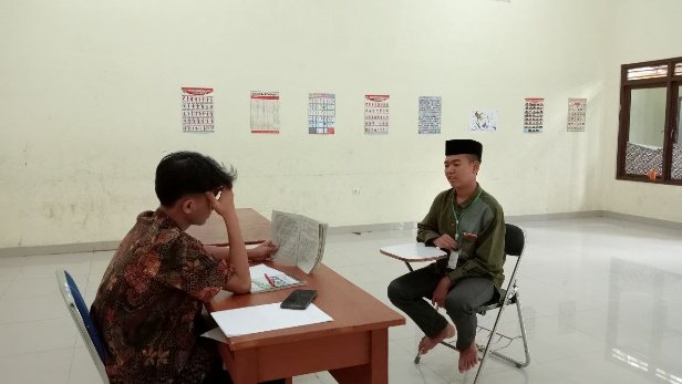 A person sitting at a desk with his head on his hand AI-generated content may be incorrect.